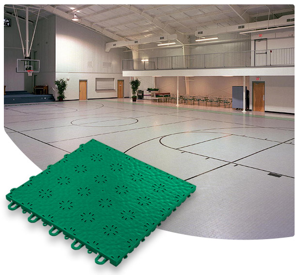 Versacourt Compete Tile green sample tile in foreground, example application at indoor basketball court in background